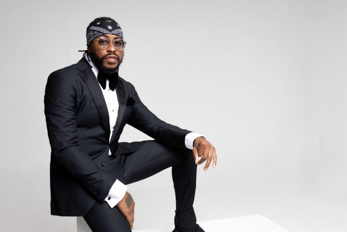 Raheem DeVaughn wearing suit and bandanna